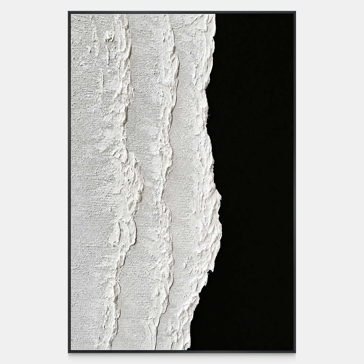Raised white texture meets a black field along an irregular vertical edge.