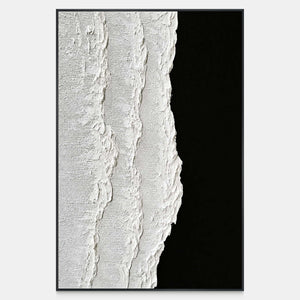 Raised white texture meets a black field along an irregular vertical edge.