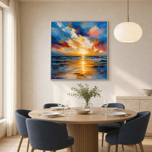 Radiant coastal sunset painting displayed in a bright contemporary dining room.