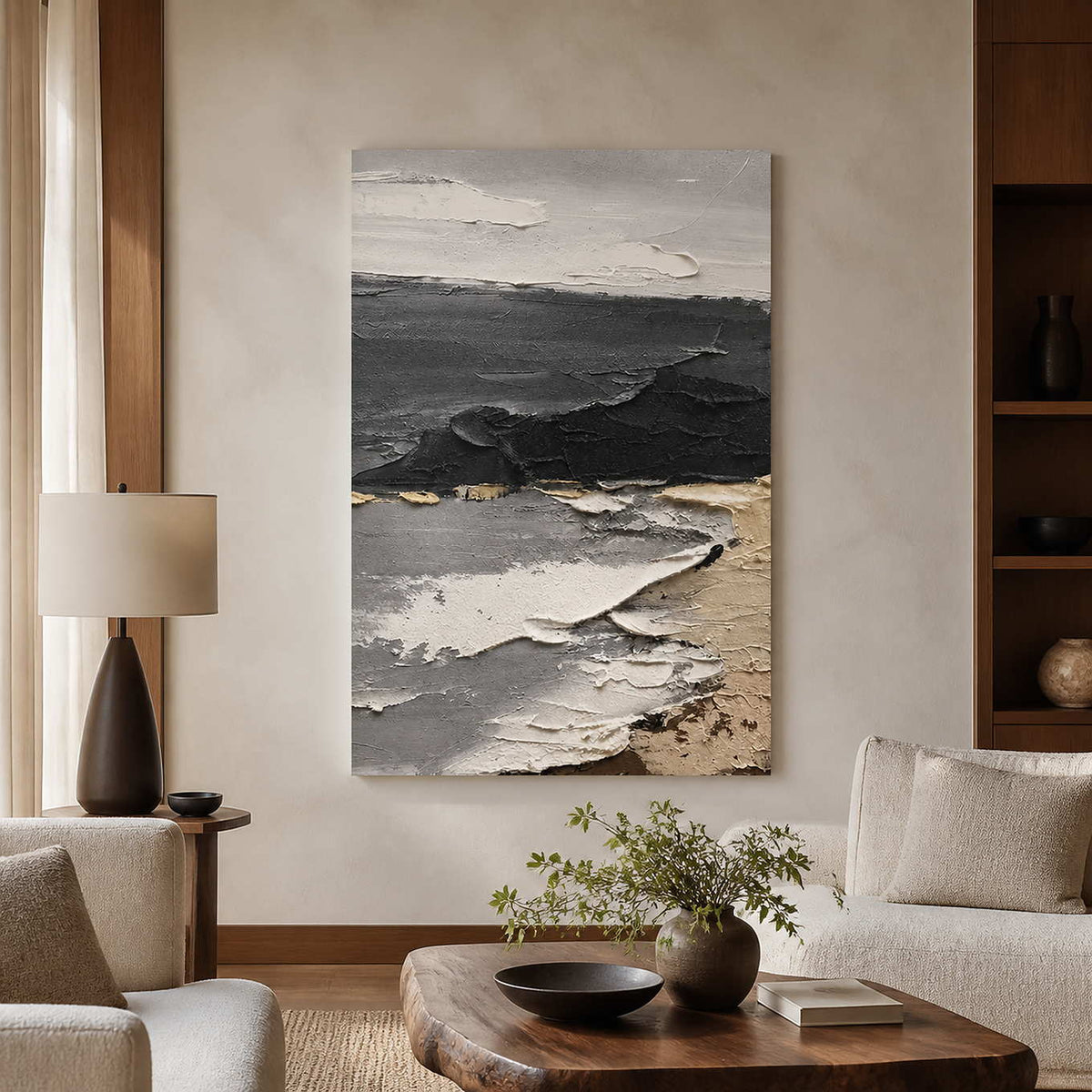 Frameless gray coastal abstract painting above cream seating and a wooden coffee table.