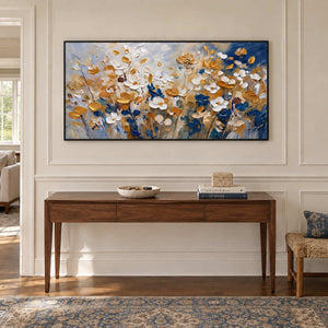 The Time to Bloom in a black frame above a slim wood console against pale hallway paneling.