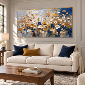 The Time to Bloom in a gold frame above a cream sofa with navy and mustard cushions and a dark wood coffee table.
