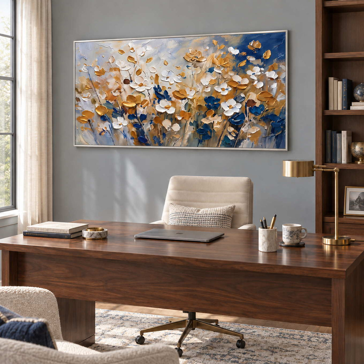 The Time to Bloom in a silver frame above a dark wood desk and cream office chair beside tall shelving.
