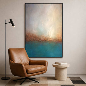 Textured turquoise abstract artwork beside a quiet reading chair.