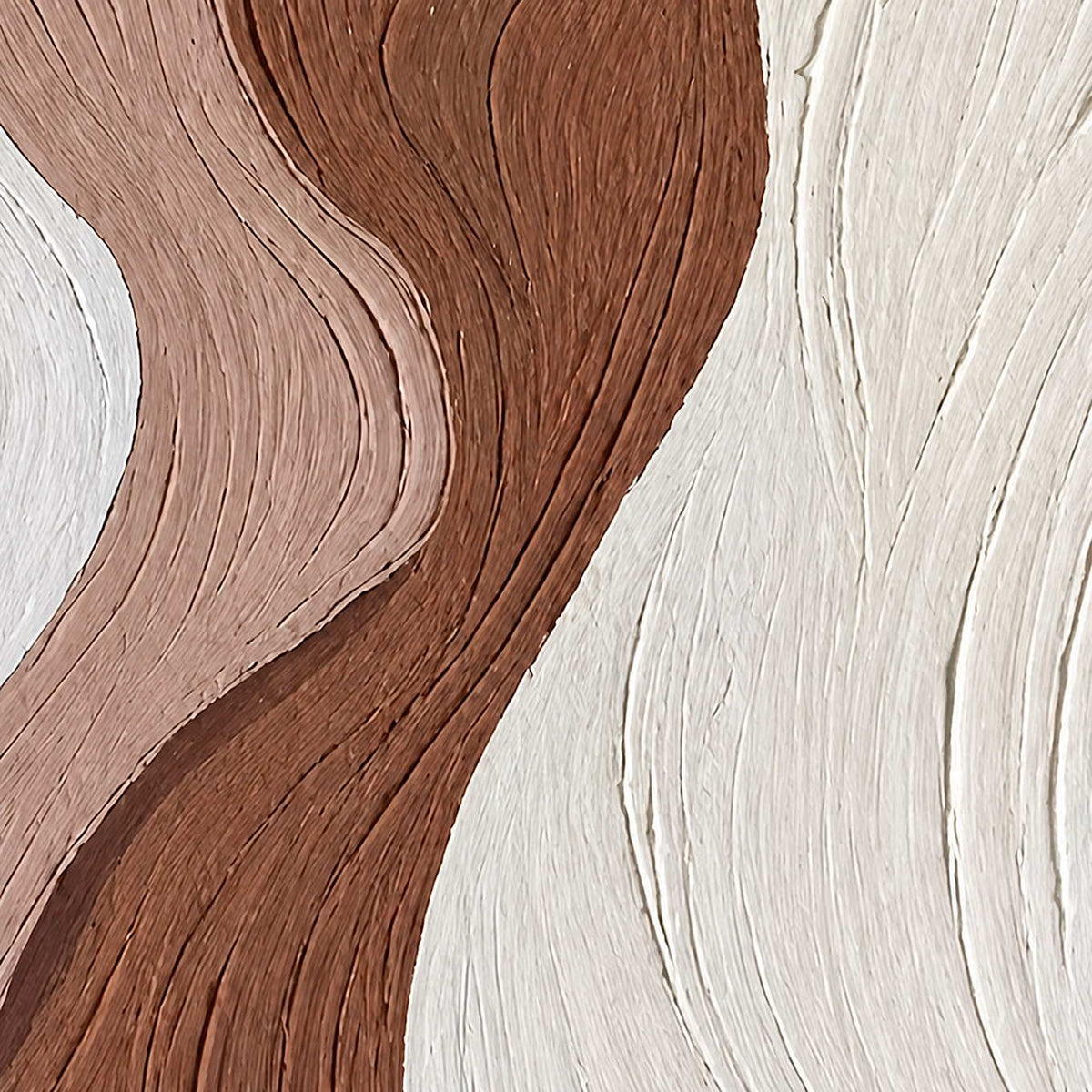 Close detail of curving grooves across white, muted blush, and brown texture.