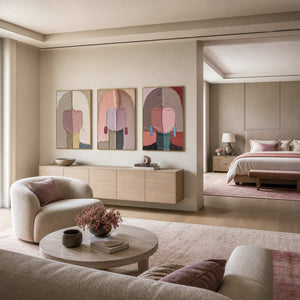 Blush portrait triptych displayed beside a softly furnished bedroom suite.
