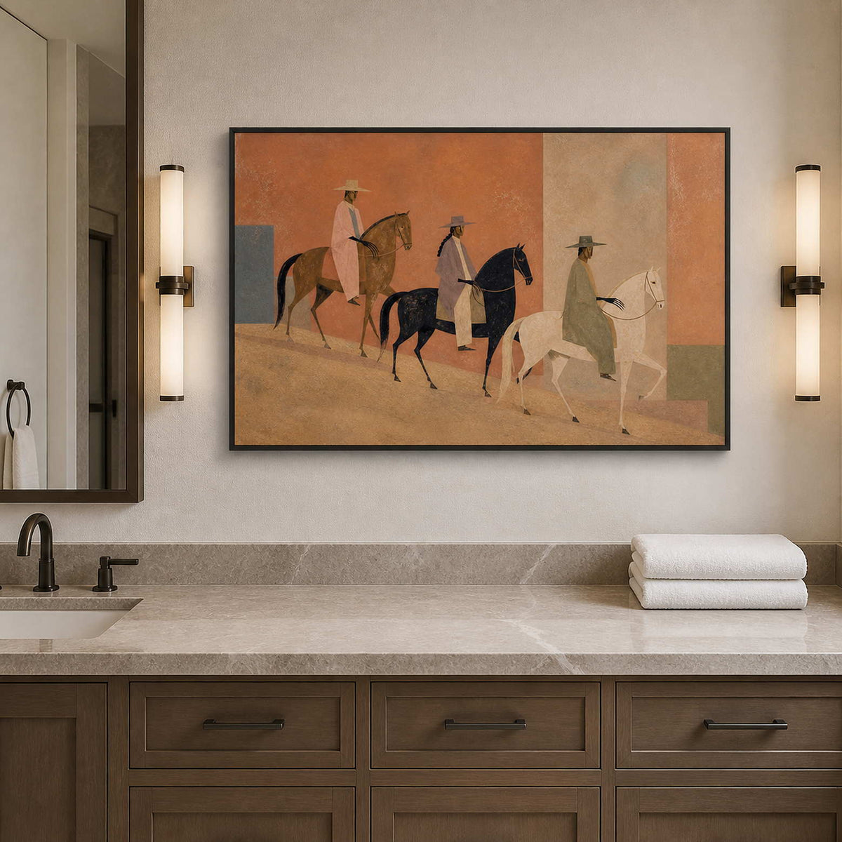 Textured horse riders artwork in a black frame above a bathroom vanity.