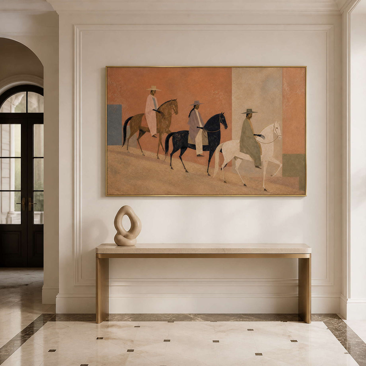 Warm horse wall art in a gold frame styled in an entryway.