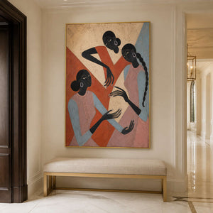 Terracotta and blush figurative artwork styled in a bright entryway.