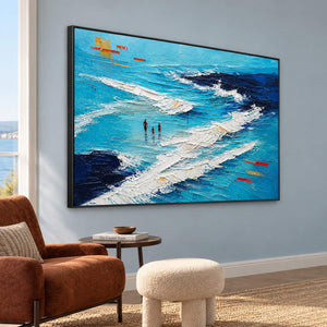 Turquoise coastal painting with three figures among white breaking waves in a black frame in a lounge.