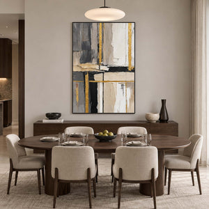 Tall gray and gold-accented artwork above a dark dining sideboard behind an oval table.