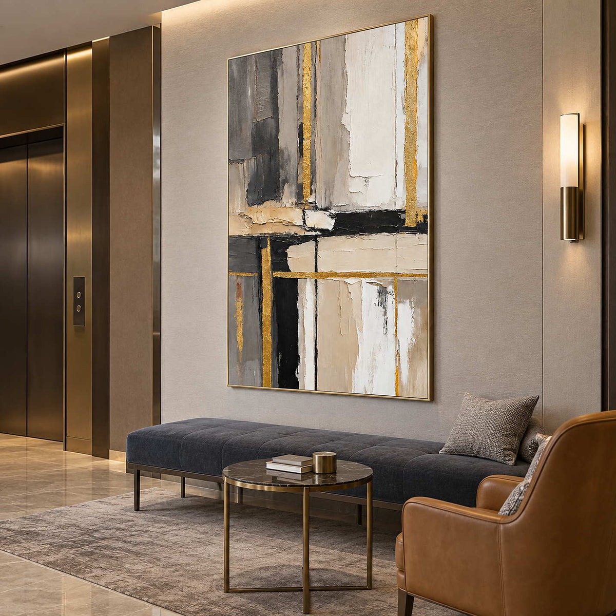 Tall textured abstract above a charcoal bench and small round table in a lounge.