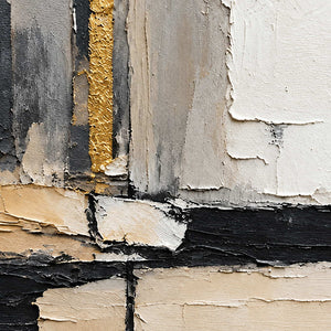 Detail of rough gray and ivory layers meeting black bands and a narrow textured golden stripe.