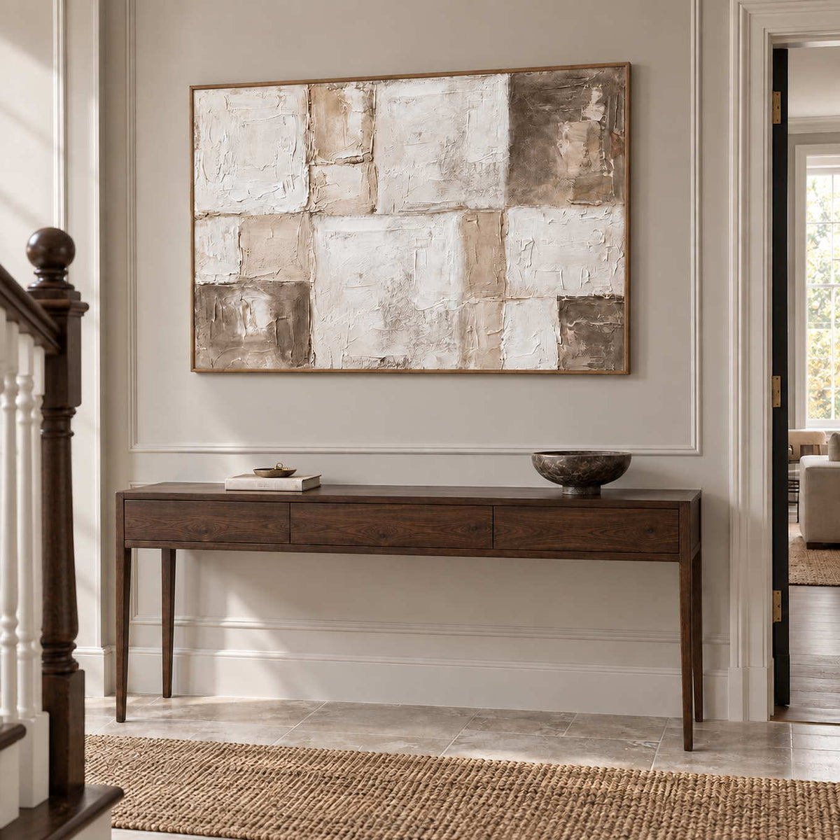 Time in Soft Focus in a wood frame above a slim dark wood console beside a staircase.