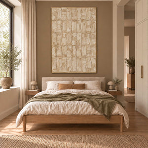 Time in Verse in a gold frame above a wood bed with neutral bedding and an olive-green throw.