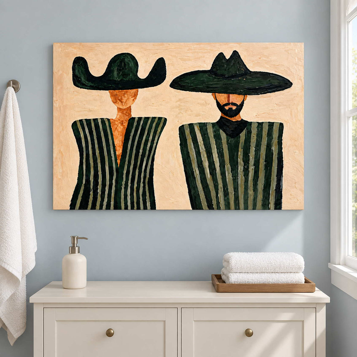 Green-striped portrait above a white cabinet with folded towels.