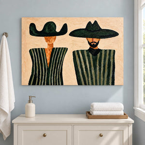 Green-striped portrait above a white cabinet with folded towels.