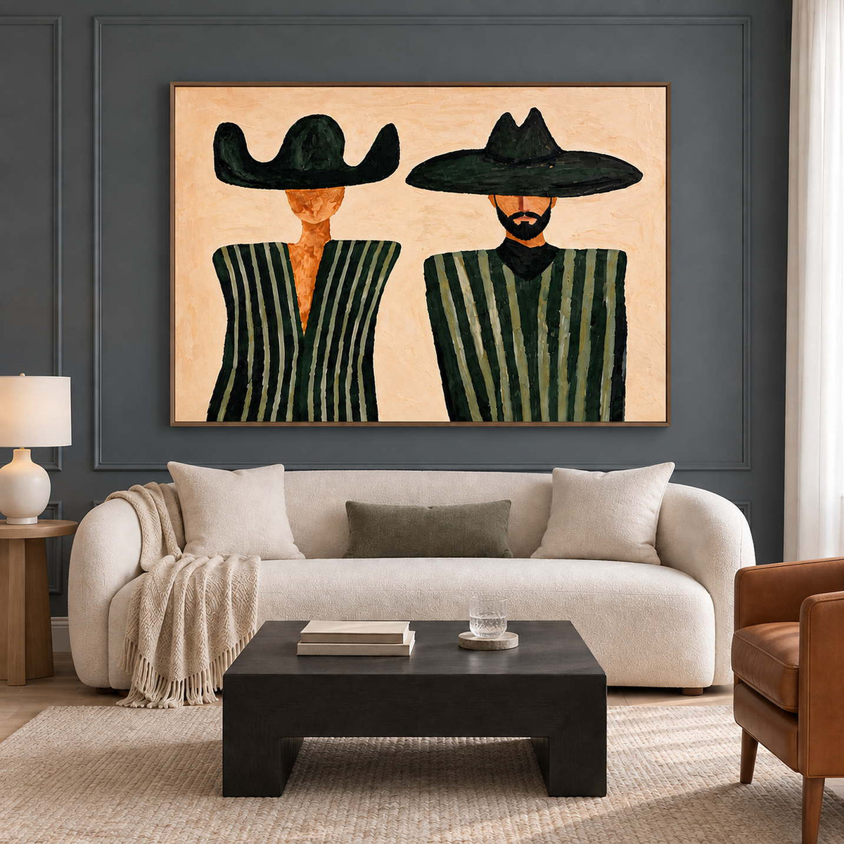 Two-hat painting above a cream sofa on a dark paneled wall.