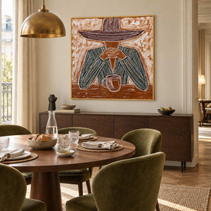 Time to Linger in a gold frame beside a round dining table with green chairs beneath a brass pendant.