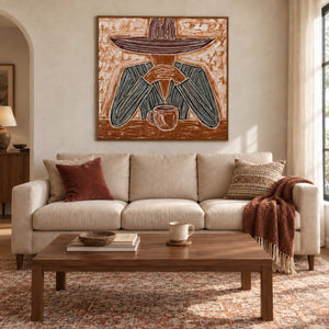 Time to Linger in a wood frame above a cream sofa with rust cushions and a rectangular wood coffee table.