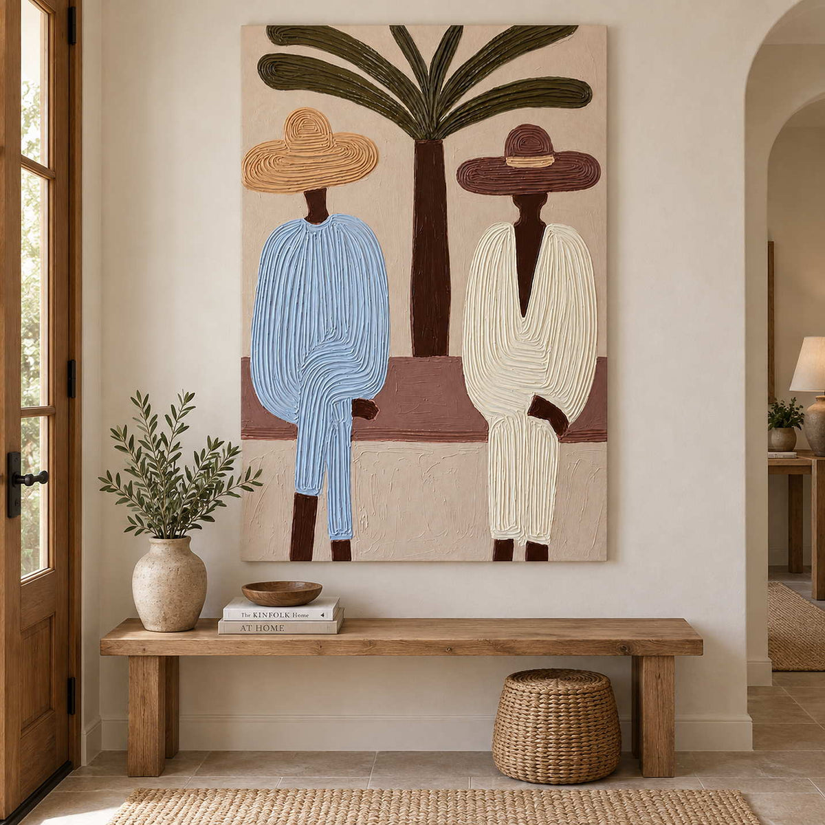 Figures beneath a palm displayed above a wood bench with a ceramic vase and woven basket.