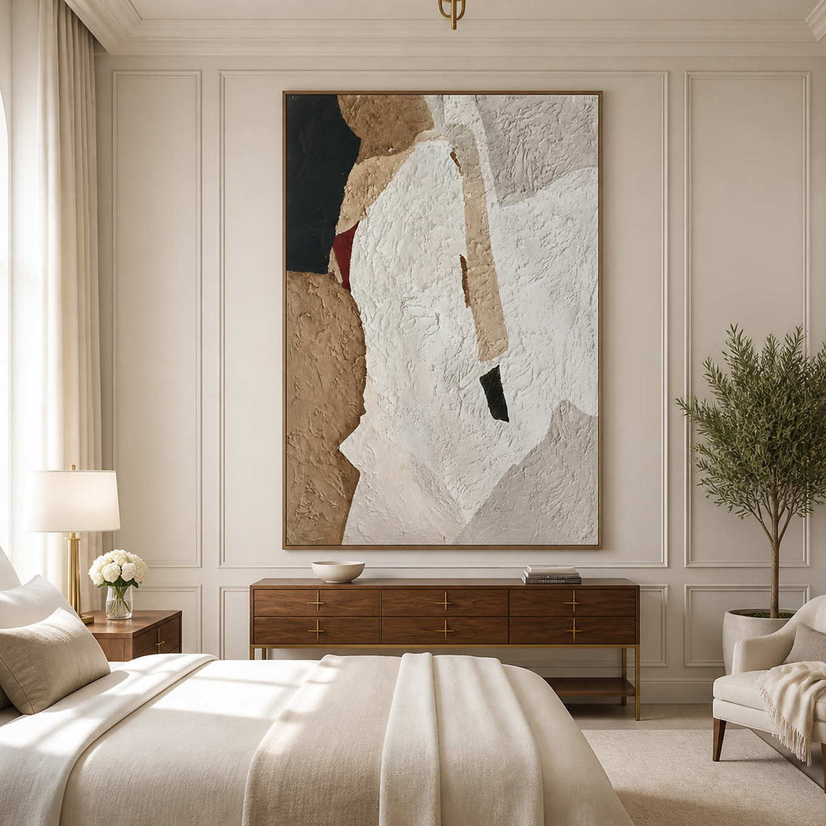 Wood framed white and sand abstract artwork above a dresser beside a softly furnished bed.