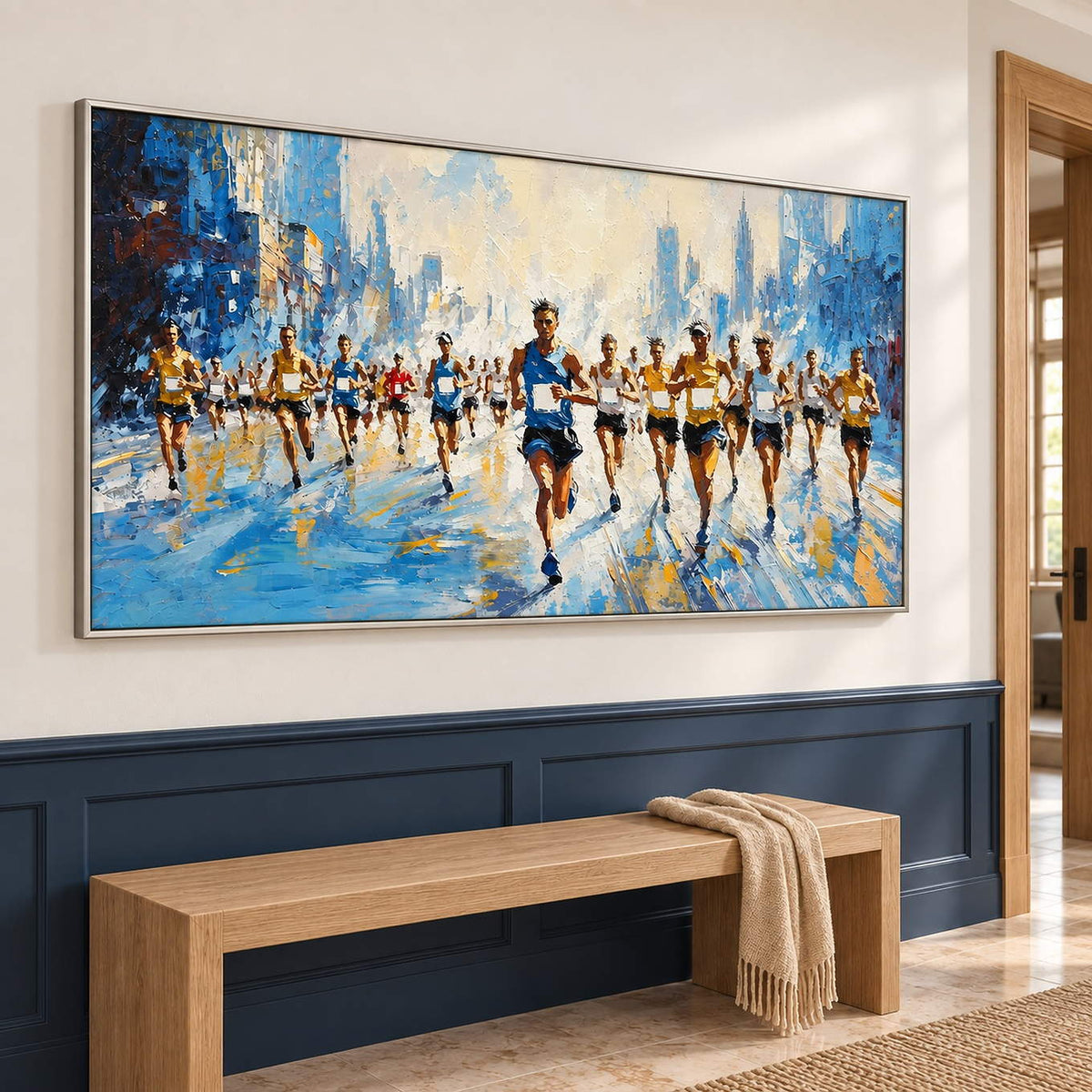 Blue and cream city running painting with a group of runners in a silver frame in a hallway.