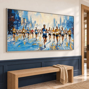 Blue and cream city running painting with a group of runners in a silver frame in a hallway.