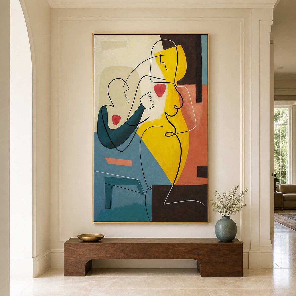 Gold-framed line-drawn figures above a curved wooden hallway bench with a small blue vase.