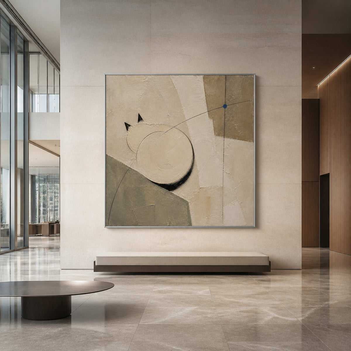 Two Circles Hold the Quiet in a silver-framed hotel lobby