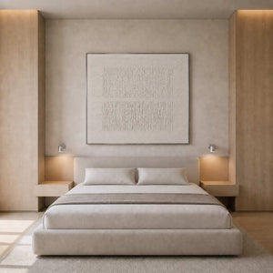 Quiet white textured artwork styled in a warm neutral bedroom.
