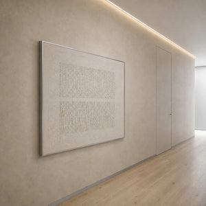 Textured monochrome artwork viewed along a warm contemporary hallway.