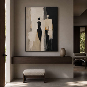 Textured figurative wall art displayed in a warm gray entryway.