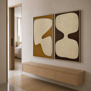 Wabi sabi wall art set viewed from a bright residential passage.