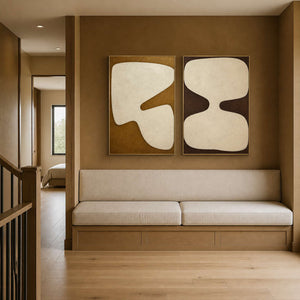 Warm abstract diptych displayed in an ochre family sitting area.