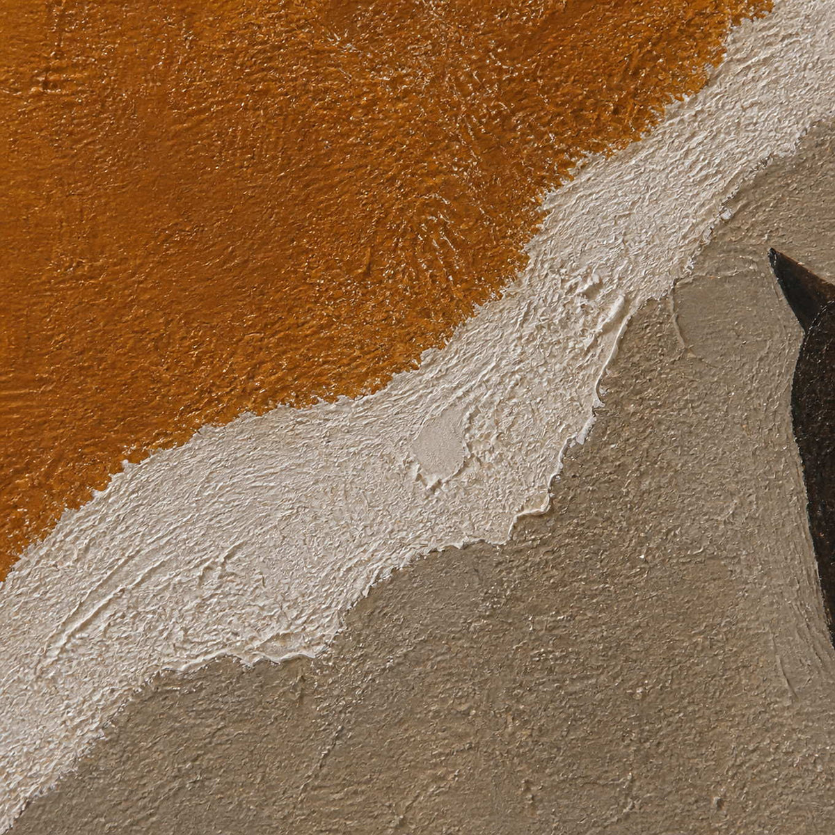 Close detail of ochre, ivory, and taupe layered canvas texture.