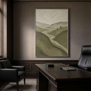 Earthy green landscape wall art in a sophisticated office with a silver frame.