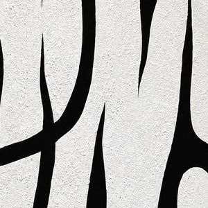 Close view of fine white surface grain bordering sweeping black curves and tapered openings.