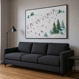 Playful alpine ski canvas above a charcoal family room sofa.