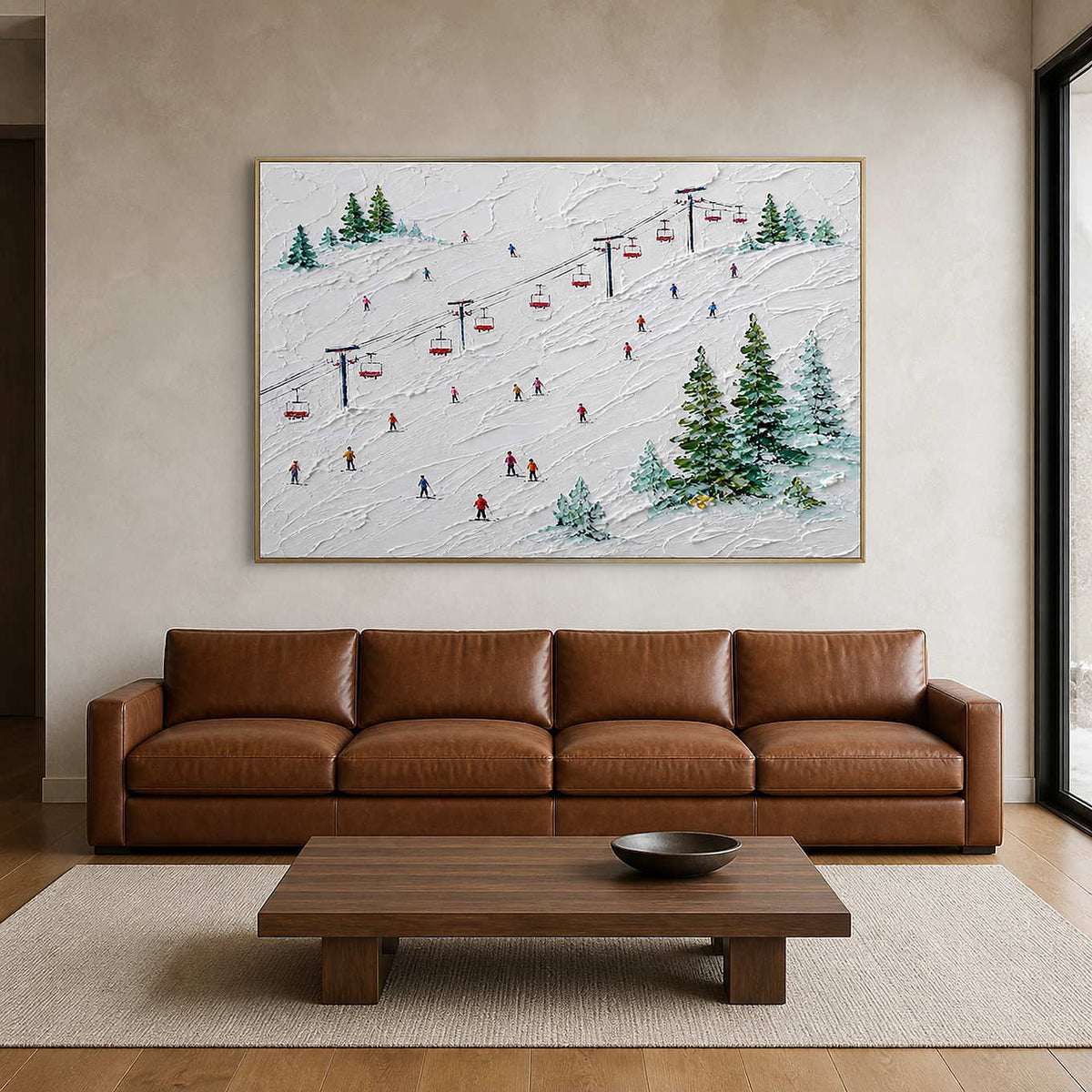 Textured ski wall art above a caramel leather sofa in a warm living room.
