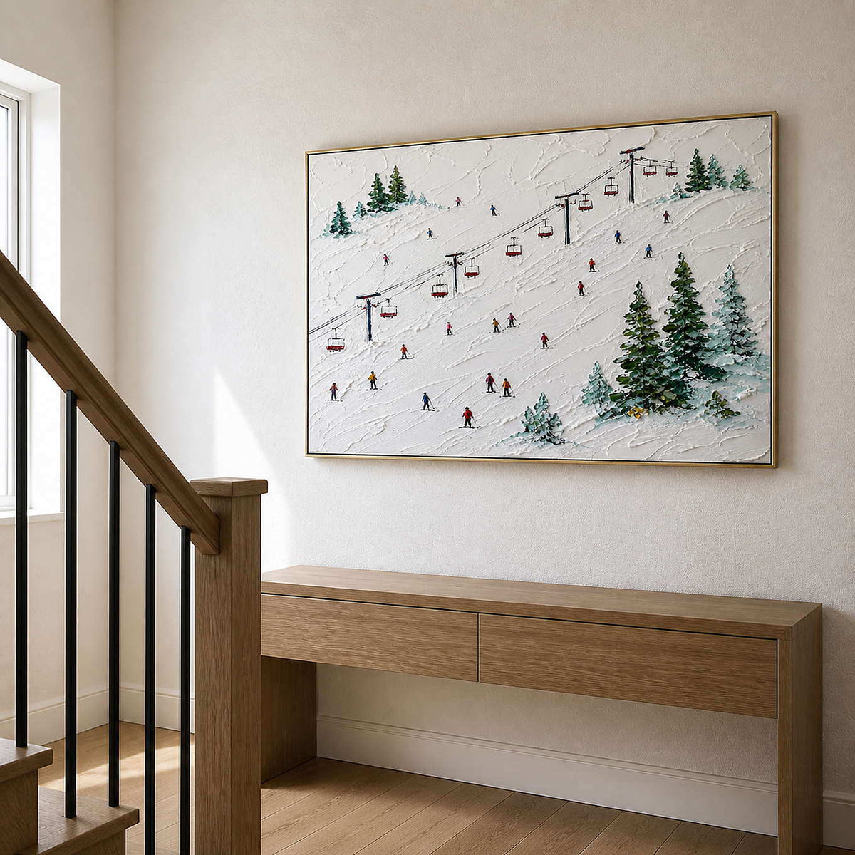 Textured winter slope artwork beside a light oak staircase.