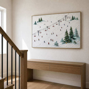 Textured winter slope artwork beside a light oak staircase.
