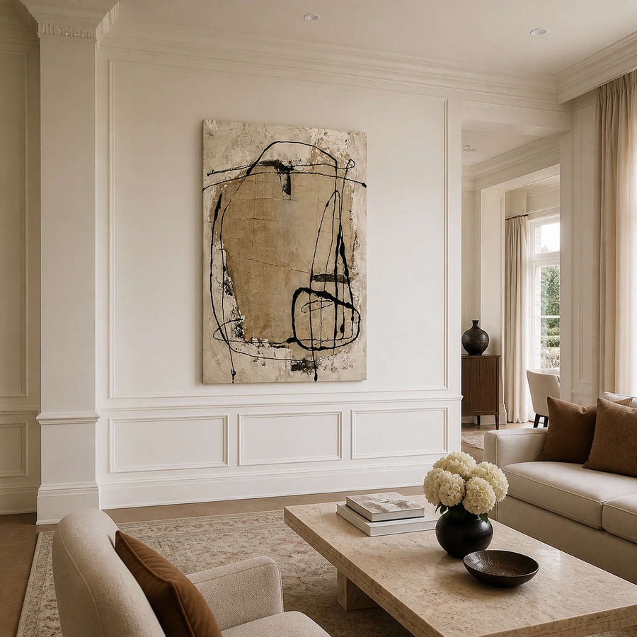 Abstract wall art with wandering black lines in a neutral living room.
