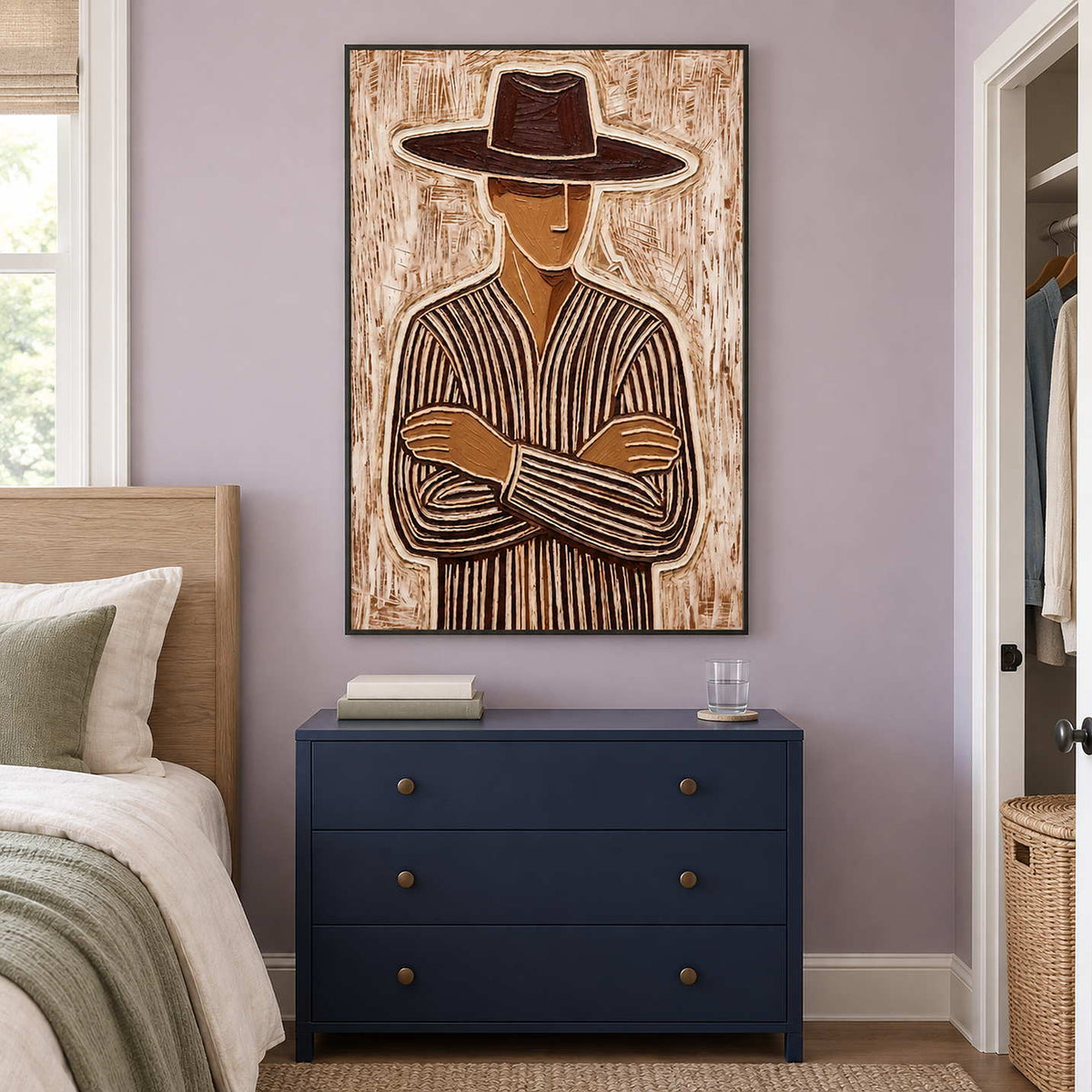 Tall neutral portrait over a navy chest on a lavender bedroom wall.