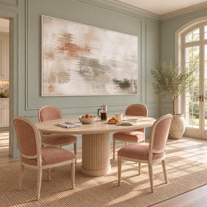 Neutral abstract painting with ivory, taupe, clay, and olive layered marks in a white frame in a breakfast dining area.