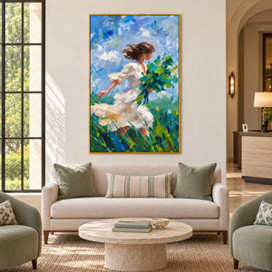 Walking into the Breeze in a gold frame above a cream loveseat with green cushions beside a tall lobby window.