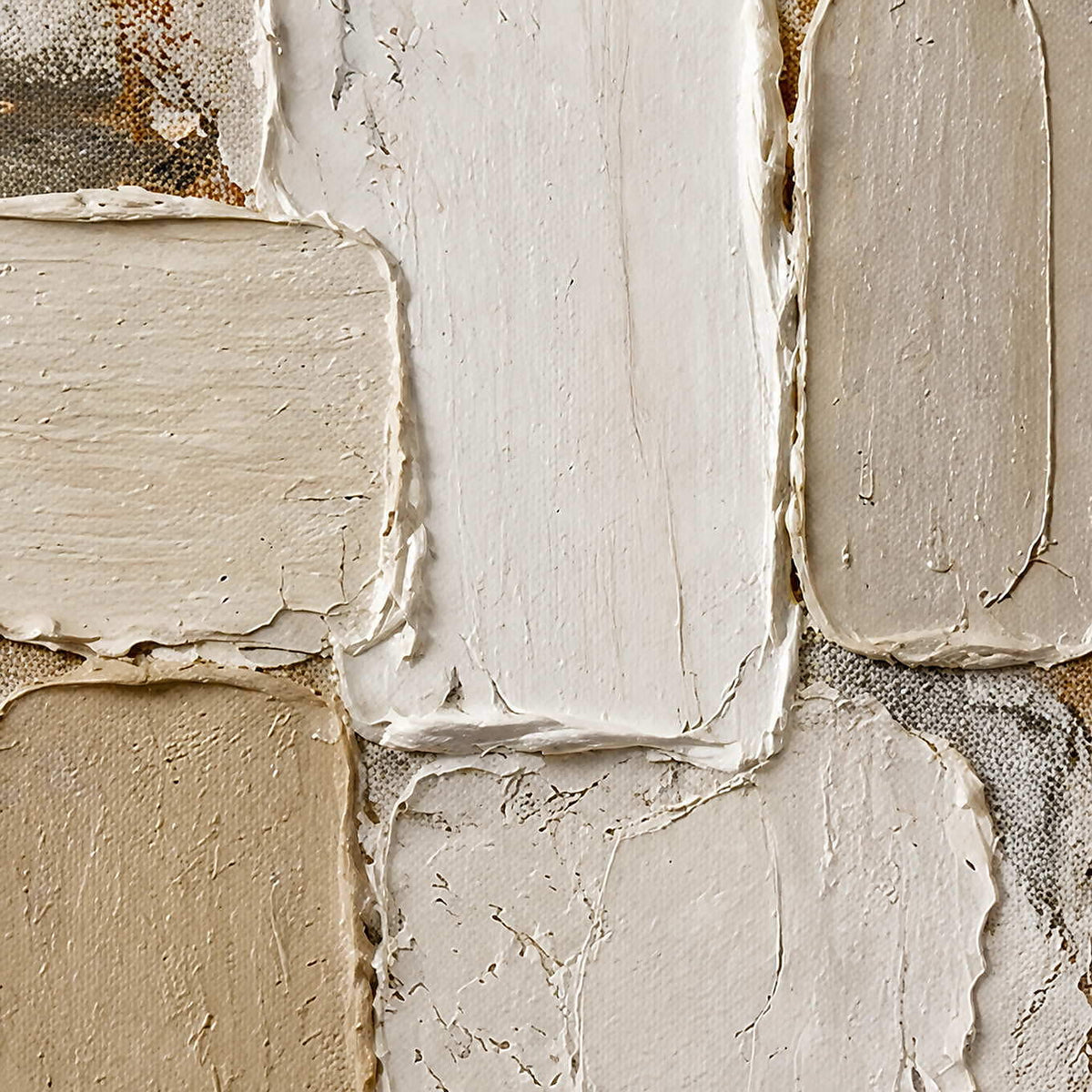 Close-up of raised ivory, cream, and taupe hand-painted block texture.
