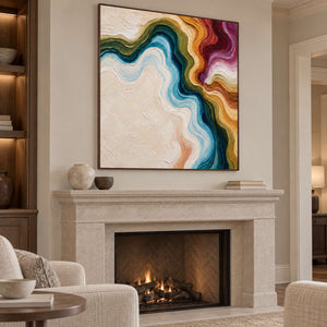 Square flowing abstract in a wood-toned frame above a pale fireplace.