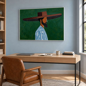 Bearded profile artwork above a wooden desk with a brown chair on a blue-gray wall.