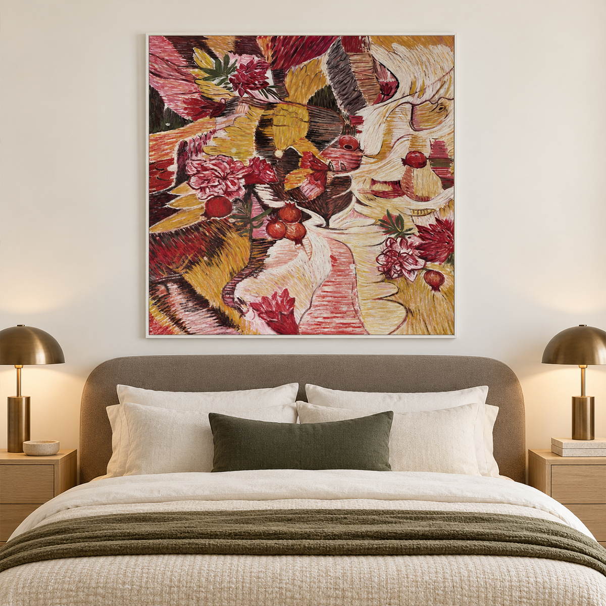 Red flowers and rounded fruit forms woven through ochre, cream and dark bands in an artwork with a white frame, displayed in a bedroom near the bed.